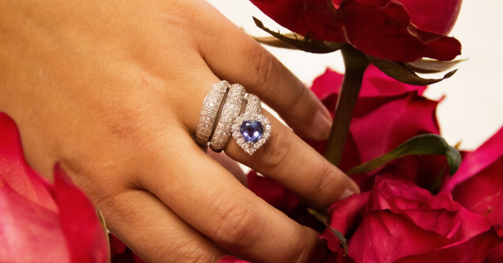 Heart shaped serpentine snake ring and red roses.