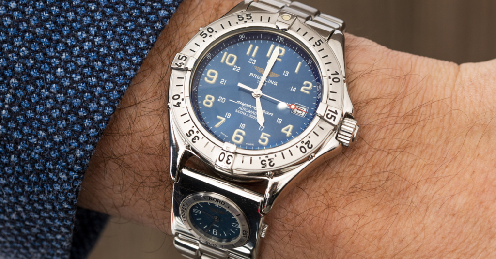 Breitling SuperOcean Watch with a blue dial and stainless steel case.